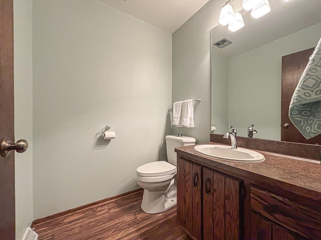21755 W N Ave, Brookfield, WI 53045 - bathroom featuring wood finished floors, toilet, and vanity