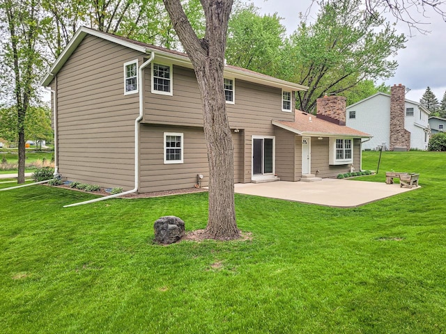 21755 W N Ave, Brookfield, WI 53045 - rear view of property featuring a patio area, a chimney, and a yard