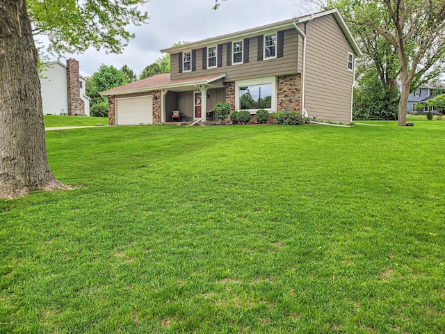 21755 W N Ave, Brookfield, WI 53045 - view of front of property with brick siding, a garage, and a front lawn