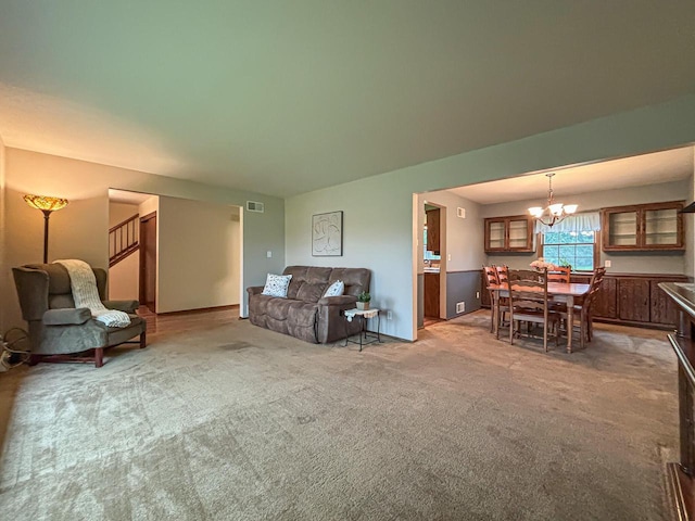 21755 W N Ave, Brookfield, WI 53045 - living area with carpet floors, a chandelier, and stairs