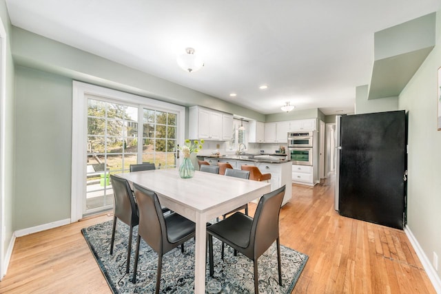 1305 Lexington Ct, Brookfield, WI 53045 - dining area with baseboards, light wood finished floors, and recessed lighting
