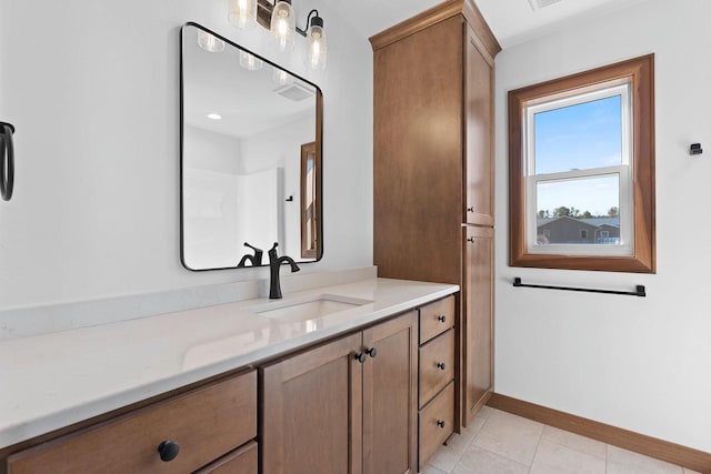513 Kirkland Ave, Algoma, WI 54201 - bathroom with vanity, baseboards, and tile patterned floors