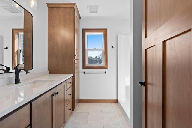 513 Kirkland Ave, Algoma, WI 54201 - bathroom with vanity, baseboards, and tile patterned floors