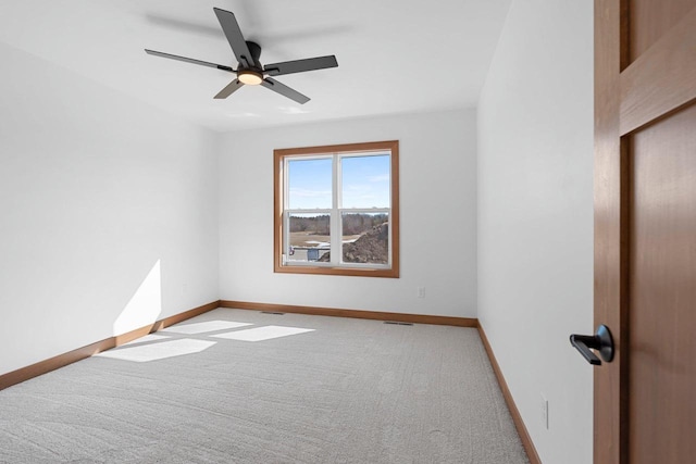 513 Kirkland Ave, Algoma, WI 54201 - carpeted spare room featuring baseboards and ceiling fan