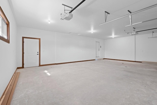 513 Kirkland Ave, Algoma, WI 54201 - garage with a garage door opener and baseboards