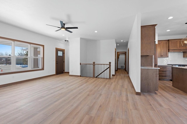 513 Kirkland Ave, Algoma, WI 54201 - kitchen featuring light wood-type flooring, recessed lighting, backsplash, light countertops, and ceiling fan