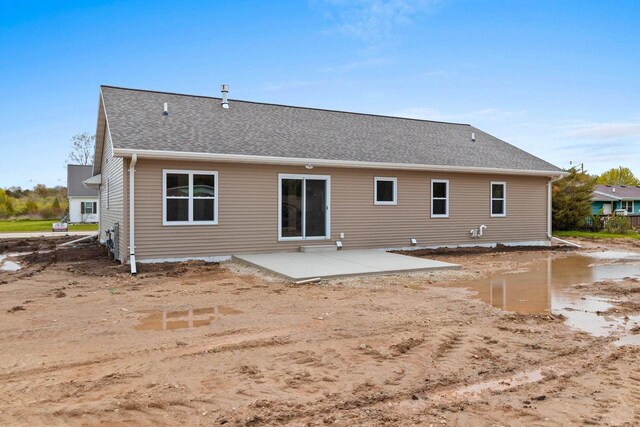 513 Kirkland Ave, Algoma, WI 54201 - back of house with a patio and roof with shingles