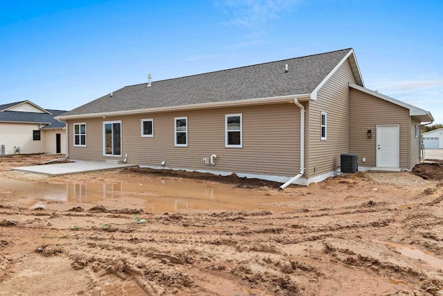 513 Kirkland Ave, Algoma, WI 54201 - rear view of house with central air condition unit and a patio