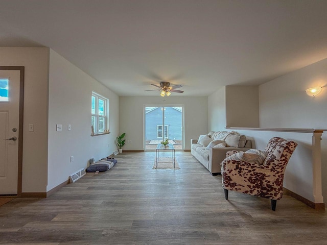 990 Morning Star Ln, Plover, WI 54467 - living area with wood finished floors, ceiling fan, and baseboards