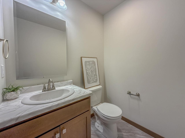 990 Morning Star Ln, Plover, WI 54467 - half bathroom with toilet, vanity, and baseboards