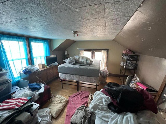 227 S 1st St, Colby, WI 54421 - bedroom featuring wood finished floors and vaulted ceiling