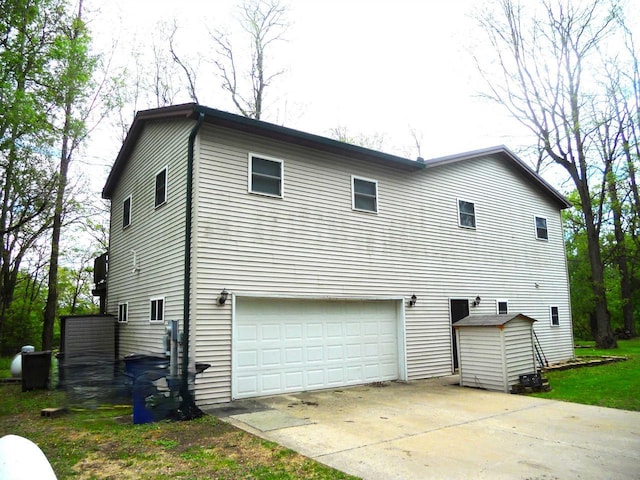 1129 Ember Dr, Adams, WI 53910 - view of home's exterior featuring a garage and driveway