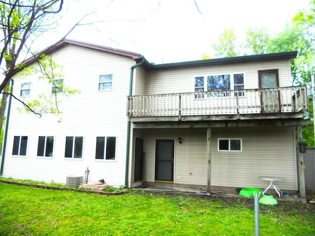 1129 Ember Dr, Adams, WI 53910 - rear view of house with a yard and central AC