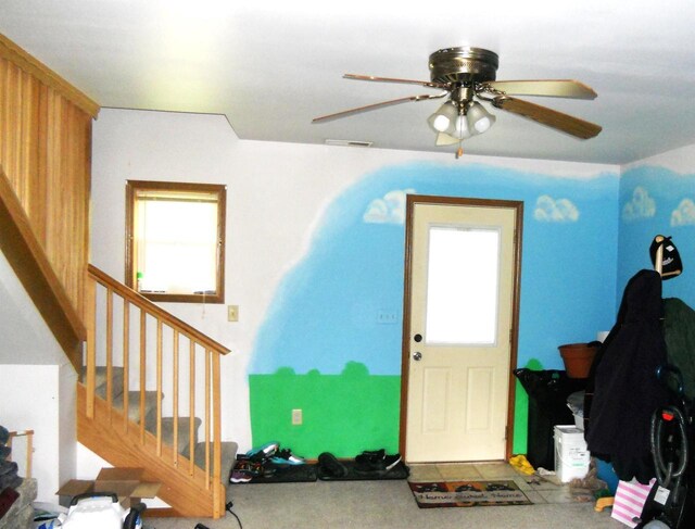 1129 Ember Dr, Adams, WI 53910 - entryway featuring stairs, ceiling fan, and carpet