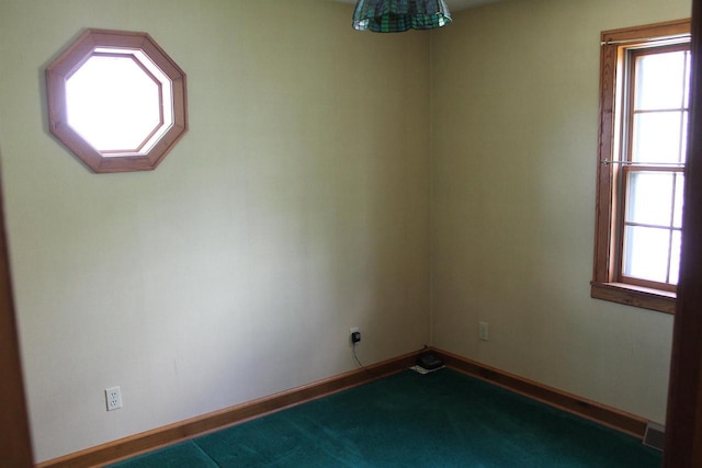 620 Oak St, Winneconne, WI 54986 - spare room featuring carpet, plenty of natural light, and baseboards
