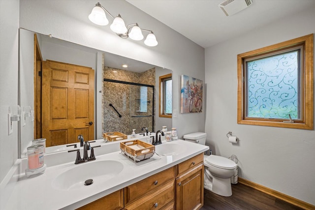S91W35161 Prairie Ct, Eagle, WI 53119 - full bath with toilet, double vanity, a stall shower, wood finished floors, and baseboards