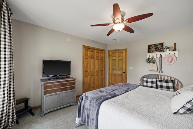 S91W35161 Prairie Ct, Eagle, WI 53119 - bedroom with light colored carpet, a closet, ceiling fan, and baseboards