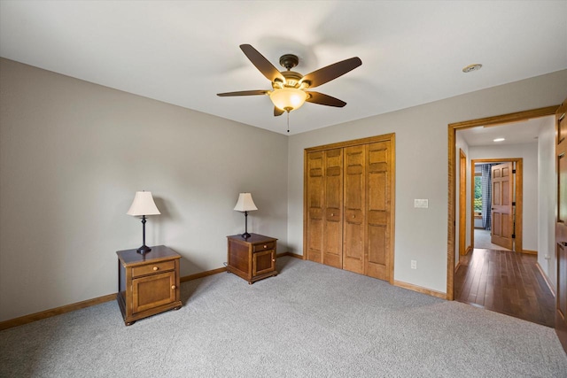 S91W35161 Prairie Ct, Eagle, WI 53119 - bedroom featuring a closet, baseboards, light carpet, and ceiling fan