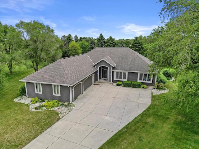 S91W35161 Prairie Ct, Eagle, WI 53119 - ranch-style home featuring a garage, concrete driveway, a front yard, and a shingled roof