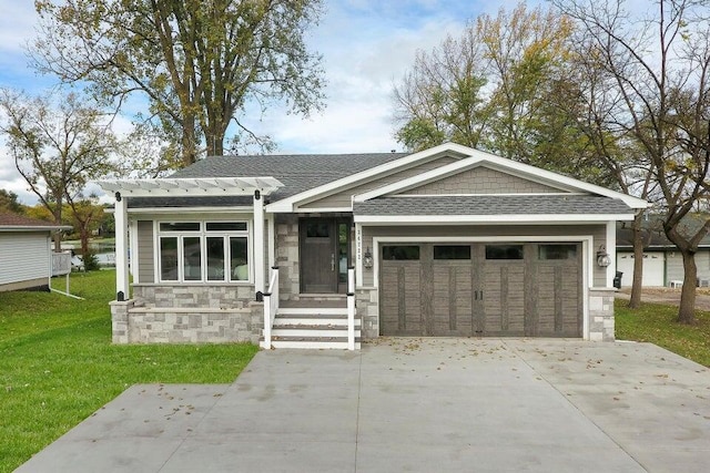 24722 84th St, Salem, WI 53168 - view of front of house featuring stone siding, driveway, a front yard, a garage, and roof with shingles