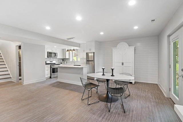 24722 84th St, Salem, WI 53168 - dining space with stairway, recessed lighting, light wood-type flooring, and baseboards