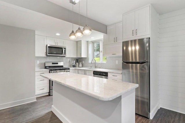 24722 84th St, Salem, WI 53168 - kitchen with stainless steel appliances, dark wood-style flooring, baseboards, a sink, and tasteful backsplash