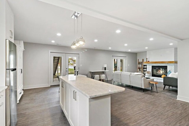 24722 84th St, Salem, WI 53168 - kitchen with french doors, freestanding refrigerator, recessed lighting, white cabinets, and baseboards
