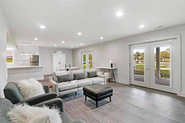 24722 84th St, Salem, WI 53168 - living area featuring french doors, light wood finished floors, recessed lighting, and baseboards