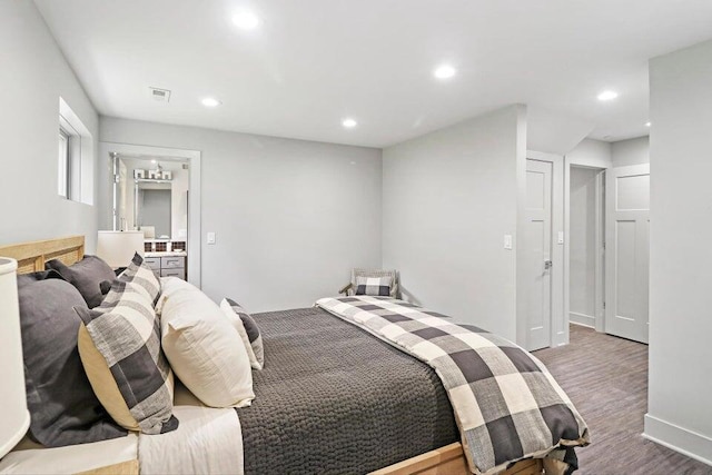 24722 84th St, Salem, WI 53168 - bedroom with wood finished floors, recessed lighting, ensuite bathroom, and baseboards