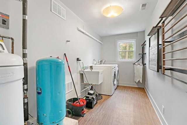 24722 84th St, Salem, WI 53168 - washroom featuring washing machine and dryer, wood finished floors, and baseboards