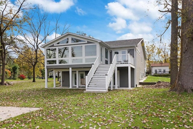 24722 84th St, Salem, WI 53168 - rear view of house featuring a sunroom, stairs, a yard, a wooden deck, and a shingled roof