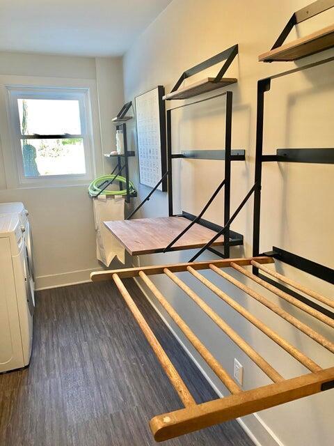 24722 84th St, Salem, WI 53168 - unfurnished bedroom with wood finished floors, baseboards, and washer and clothes dryer