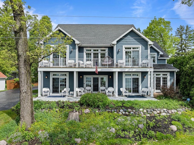 W3920 Lake Shore Dr, Lake Geneva, WI 53147 - rear view of house featuring a patio, french doors, and a shingled roof