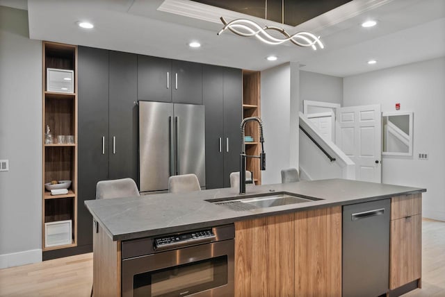 W3920 Lake Shore Dr, Lake Geneva, WI 53147 - kitchen featuring stainless steel appliances, a sink, open shelves, light wood-style floors, and recessed lighting