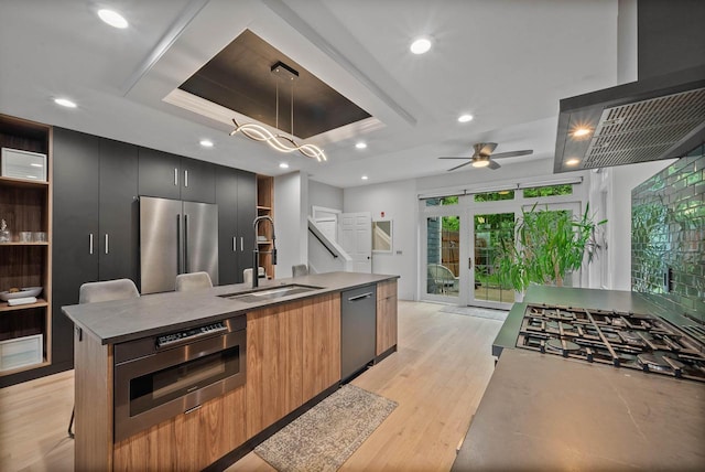 W3920 Lake Shore Dr, Lake Geneva, WI 53147 - kitchen featuring stainless steel appliances, a sink, modern cabinets, an island with sink, and recessed lighting