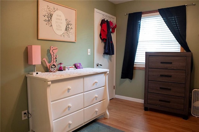 203 E Maple St, Thorp, WI 54771 - bedroom featuring light wood-style flooring and baseboards