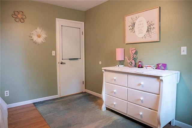 203 E Maple St, Thorp, WI 54771 - bedroom featuring baseboards and wood finished floors