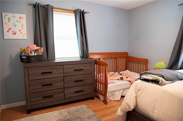 203 E Maple St, Thorp, WI 54771 - bedroom with light wood finished floors and baseboards