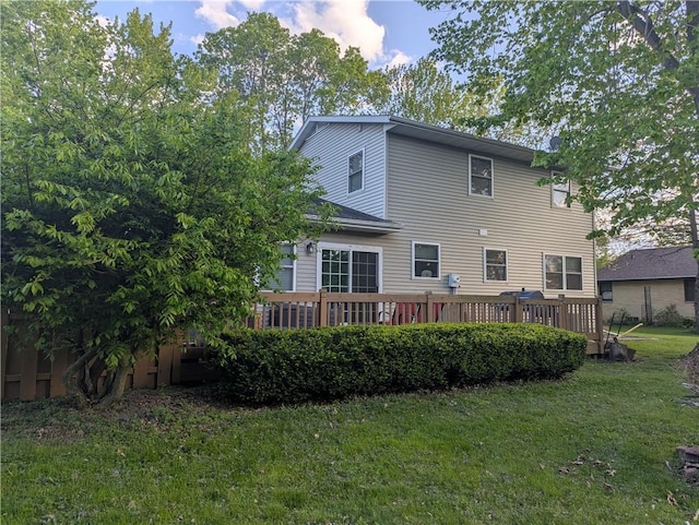 203 E Maple St, Thorp, WI 54771 - back of property with a yard and a deck