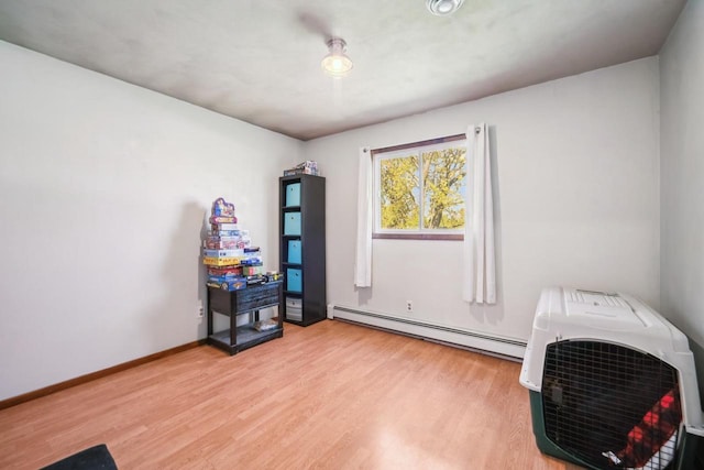 1116 Lake Park Rd, Menasha, WI 54952 - home office with a baseboard radiator, light wood-style flooring, and baseboards