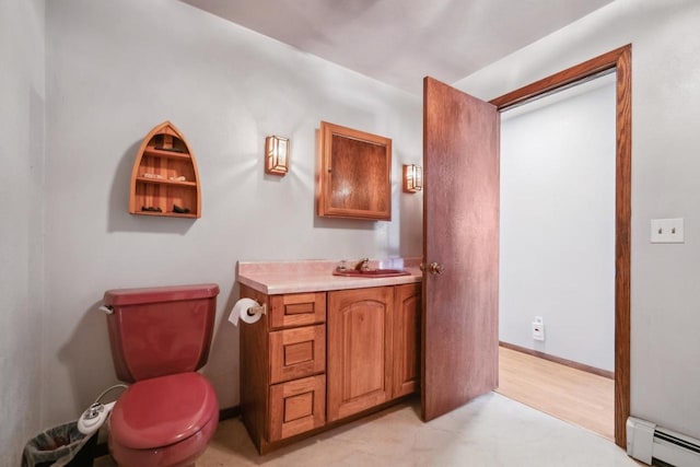 1116 Lake Park Rd, Menasha, WI 54952 - bathroom with a baseboard radiator, vanity, and toilet