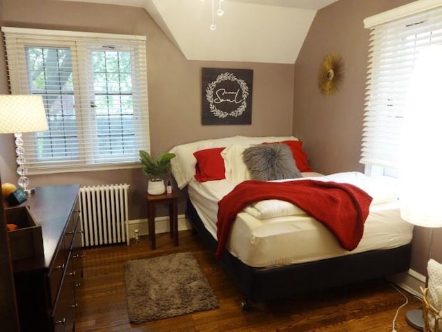 7320 5th Ave, Kenosha, WI 53143 - bedroom with radiator, wood finished floors, lofted ceiling, and baseboards