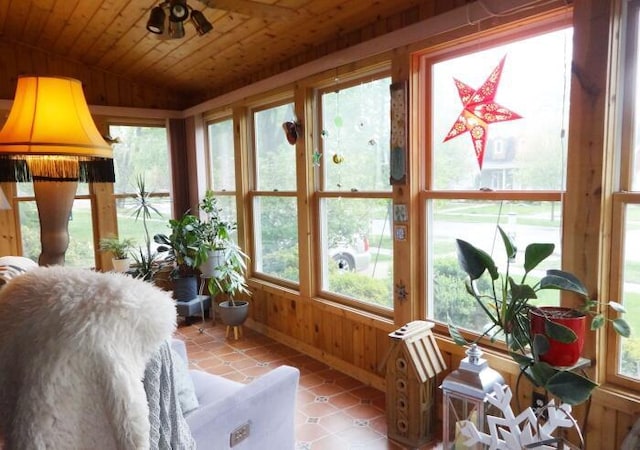 7320 5th Ave, Kenosha, WI 53143 - sunroom / solarium featuring vaulted ceiling, plenty of natural light, wooden ceiling, wooden walls, and tile patterned floors