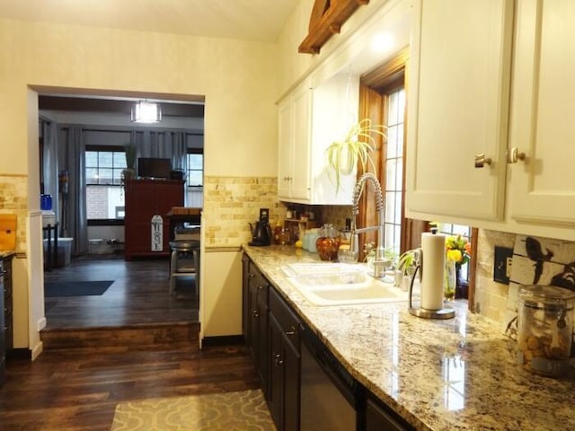 7320 5th Ave, Kenosha, WI 53143 - kitchen featuring a sink, dishwasher, dark wood finished floors, light stone countertops, and white cabinetry