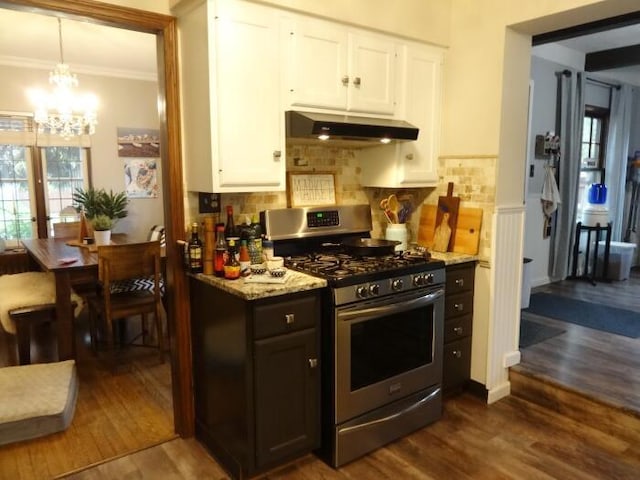 7320 5th Ave, Kenosha, WI 53143 - kitchen featuring stainless steel range with gas cooktop, under cabinet range hood, white cabinetry, dark wood-type flooring, and a chandelier