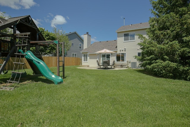 6622 96th Ave, Kenosha, WI 53142 - rear view of house featuring a playground, a patio area, and central AC