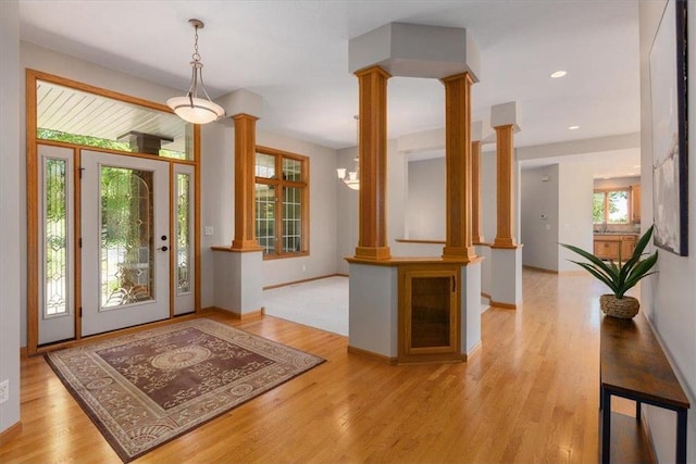 15210 Painters Lane Cir, Stillwater, MN 55082 - entrance foyer featuring decorative columns, light wood-style floors, baseboards, and recessed lighting