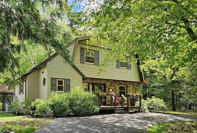 9388 Alpine Rd, Fremont, WI 54940 - view of front facade featuring a deck and cooling unit