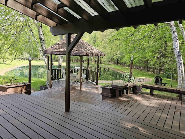 9388 Alpine Rd, Fremont, WI 54940 - wooden terrace with a yard and a wooded view