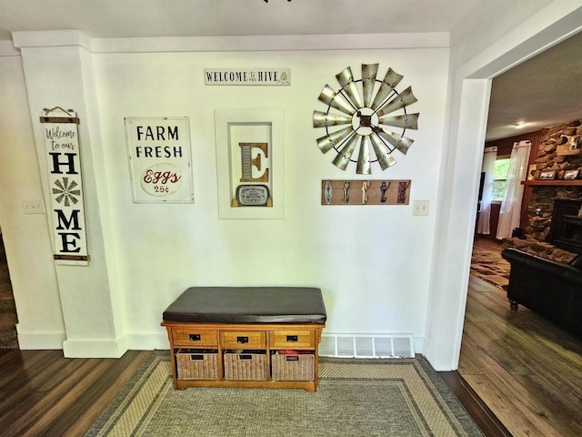 9388 Alpine Rd, Fremont, WI 54940 - hallway featuring dark wood-style floors, a chandelier, and baseboards